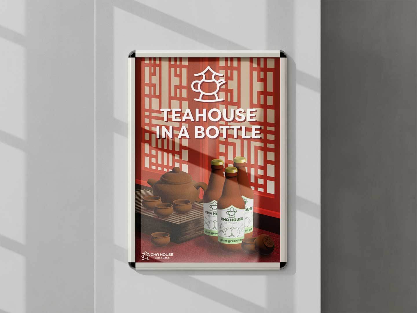 Mockup of the Cha House Kombucha poster on a wall